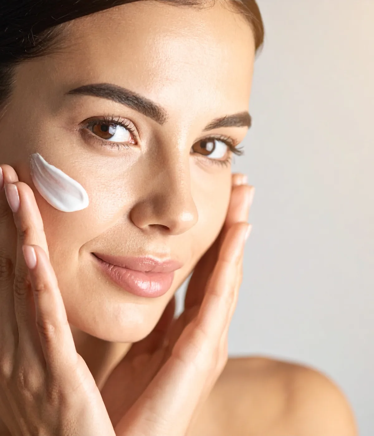 A guest applying skincare aftercare, first-time offers at Wax On Wax Off
